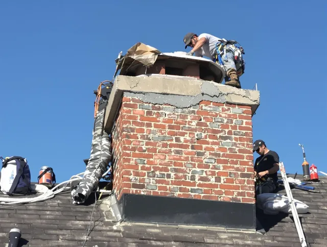 New London Chimney Sweep installing a custom chimney crown in New London, CT